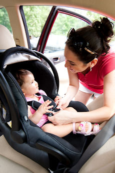 Baby restrained in child seat.